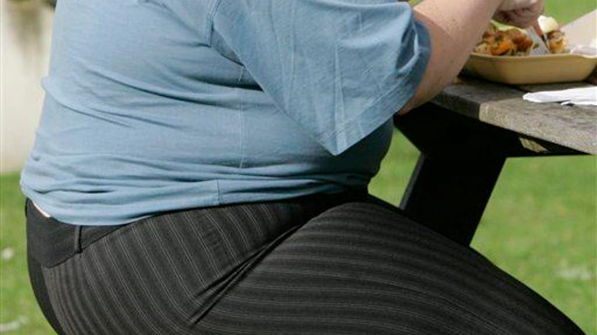 This is a photo of the archive on Wednesday, October 17, 2007 of a person with overweight who eats in London.